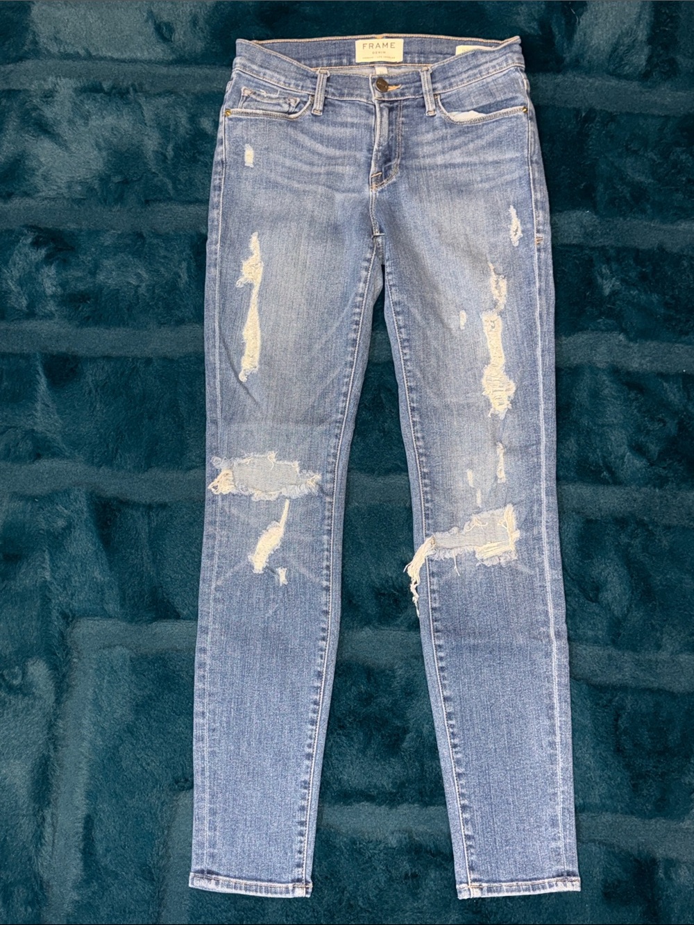 Frame Denim Light Wash Distressed Skinny Jeans